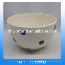 White hand painted ceramic bowls with blue dot painting